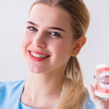 Smiling Girl having the Denture